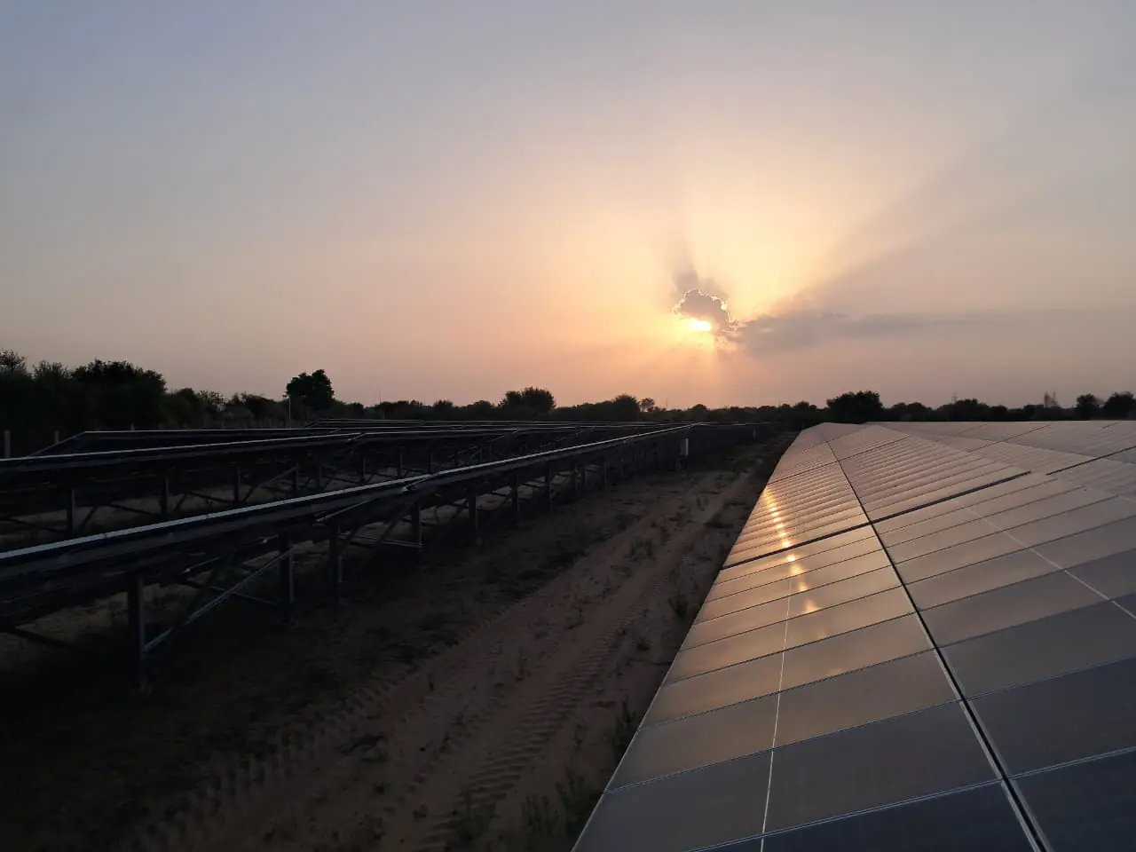 Solar modules and mounting structures with the sun low on the horizon